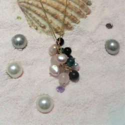 Golden pendant with gemstones and pearls